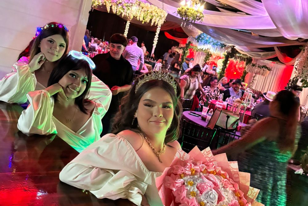 Friends and guests surrounding the quince girl.