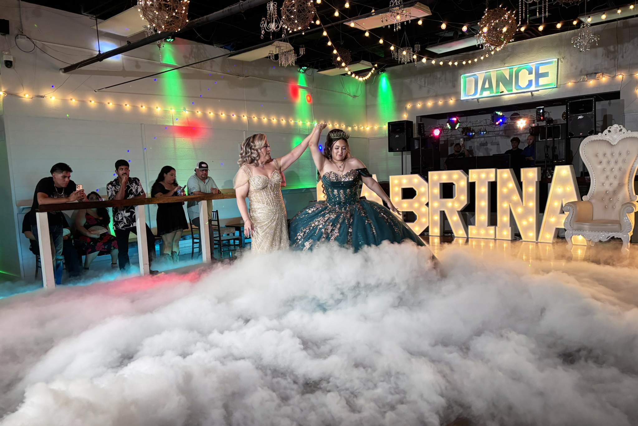 Mother & daughter dancing on a cloud of fog.