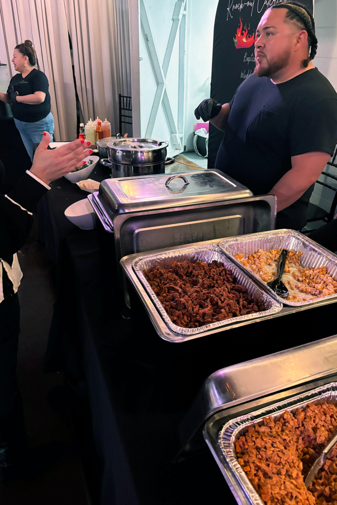 Taco buffet wwith servers that about to serve guests - set up and ready for guests