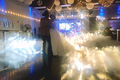First dance on the smoke filled dance floor supported with beautiful lighting effects.