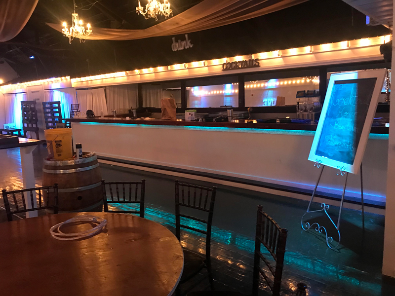 Bar area with custom lighting design matching event colors and theme
