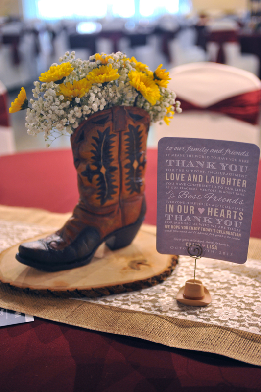 Cowboy boot with floral centerpiece with greenery designed for guest tables at The Chateau at Forest Park
