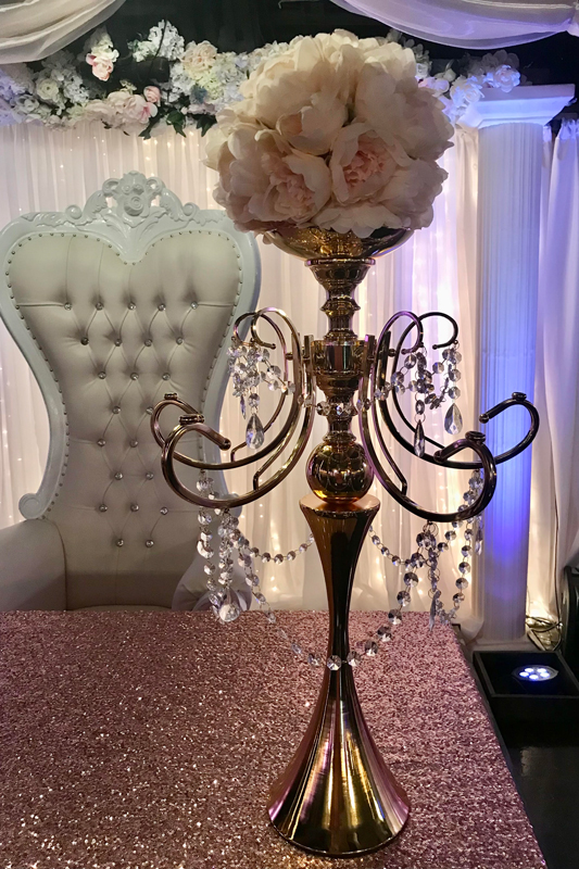 Gold frame candelabra centerpiece with floral accents for a formal wedding reception at The Chateau at Forest Park