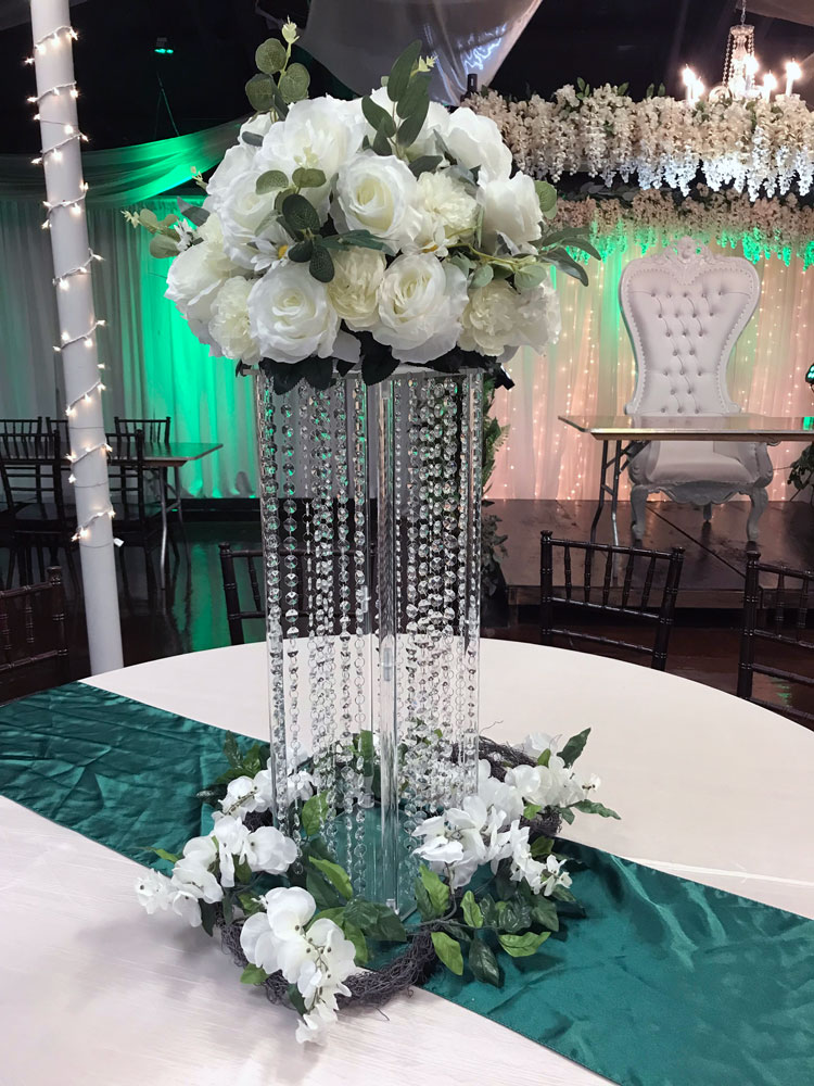 Luxury oversized tall centerpiece with dramatic florals and lighting at The Chateau at Forest Park