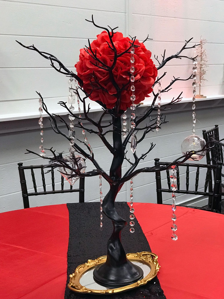 Rustic black branch centerpiece with natural wood elements and jewels at The Chateau at Forest Park