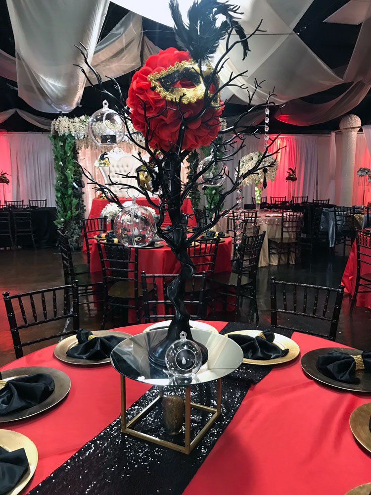 Tall branch centerpiece with floral wood elements at The Chateau at Forest Park