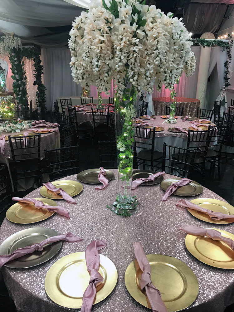 Luxury oversized centerpiece with dramatic florals and lighting at The Chateau at Forest Park