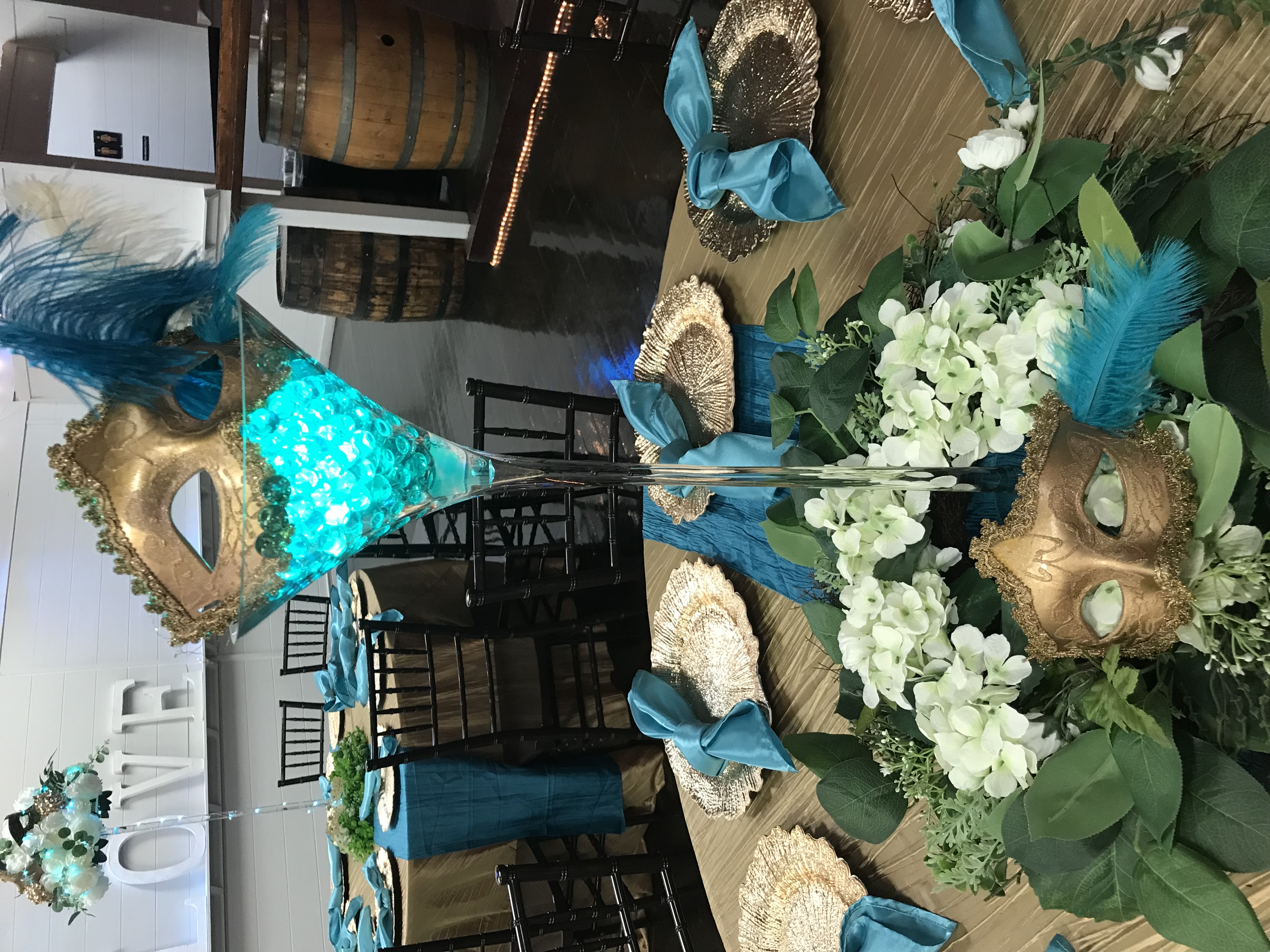 Modern tall martini glass vase centerpiece with gel beads, lights and more at the Chateau event venue