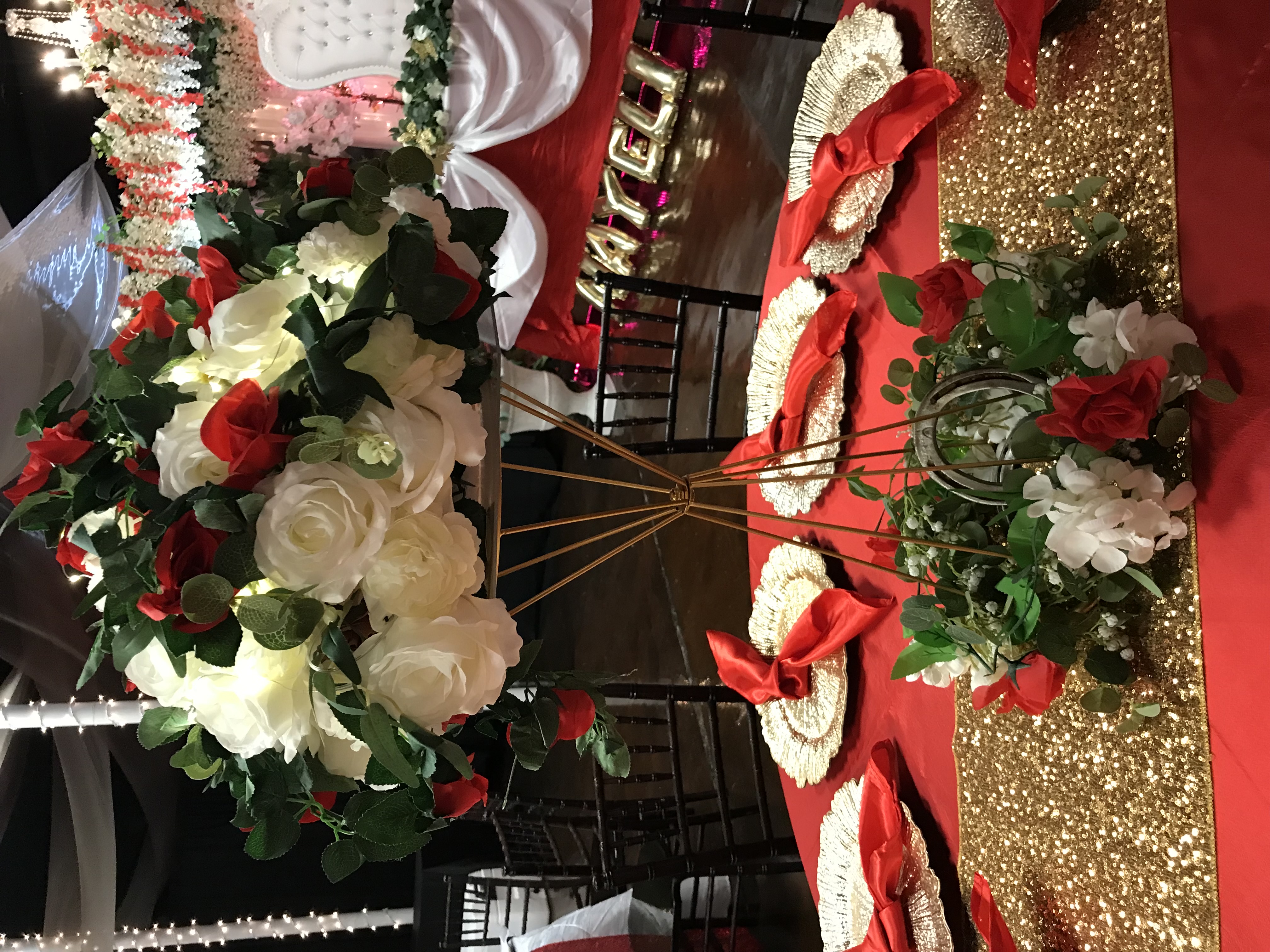 Gold frame centerpiece with flowers, greenery and more at the Chateau event venue