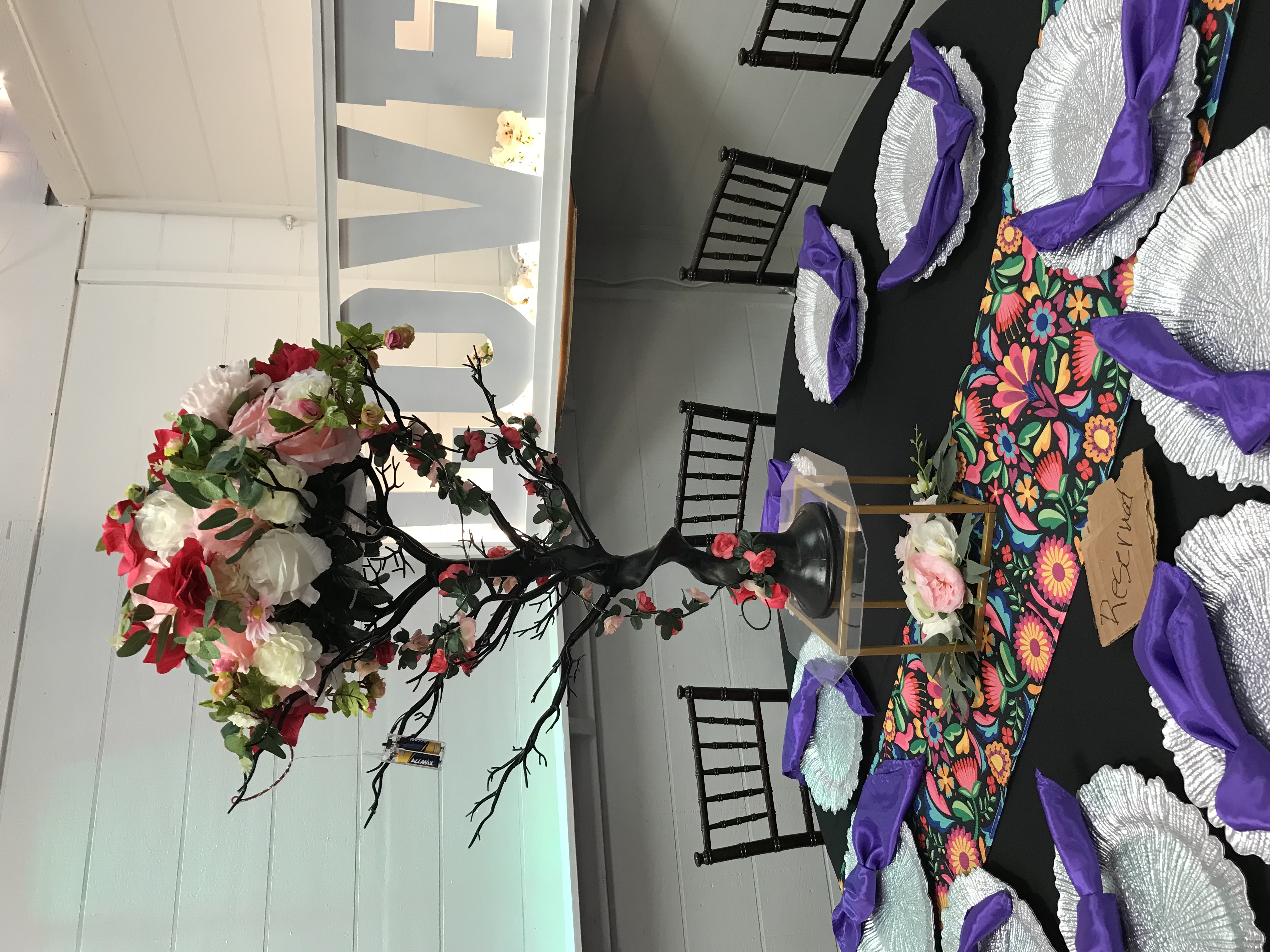 Rustic branch centerpiece with flower ball, natural wood elements and greenery at The Chateau at Forest Park