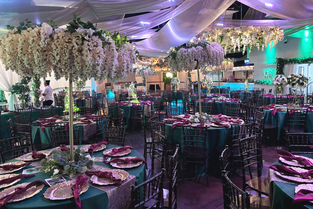 Custom uplighting colors transforming the ballroom atmosphere at The Chateau at Forest Park