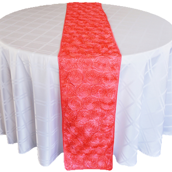 Table runner centered over guest table linen for added color and texture