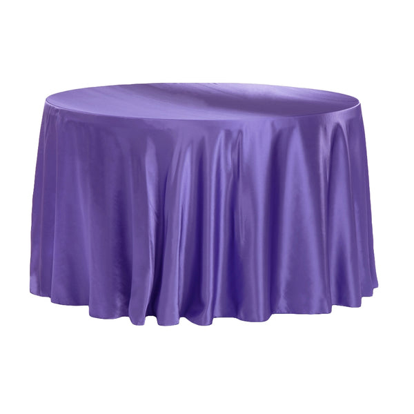 Floor-length guest table linens styled for an elegant wedding or event reception