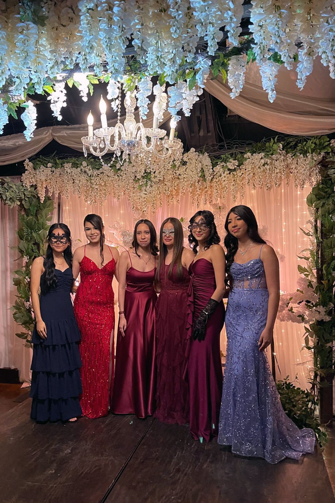 Photo op under the floral canopy with accent lighting