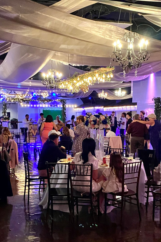 Corporate event ballroom with formal table linens and centerpiece decor