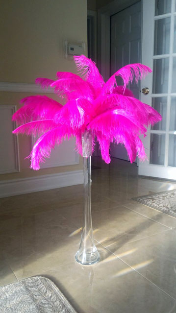 Romantic pink ostrich feather centerpiece designed for an elegant reception