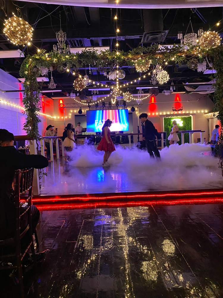 Dance floor fog surrounded by rich red lighting for an evening of dancing and celebration