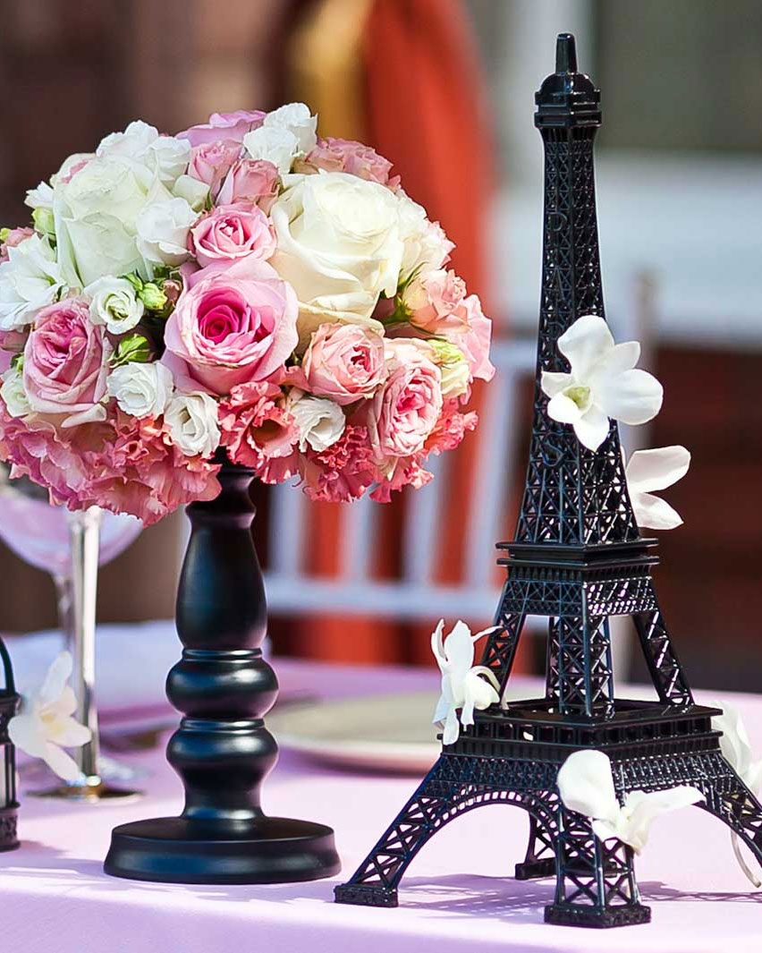 Parisian Enchantment event theme table design with romantic lighting